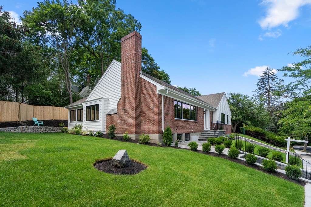 30 Clinton Road Brookline, MA 02445 - Photo 3 of 19 a front view of house with a garden