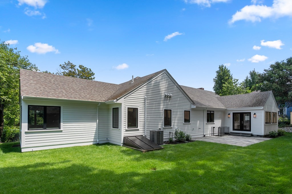 30 Clinton Road Brookline, MA 02445 - Photo 4 of 19 a view of a house with a backyard