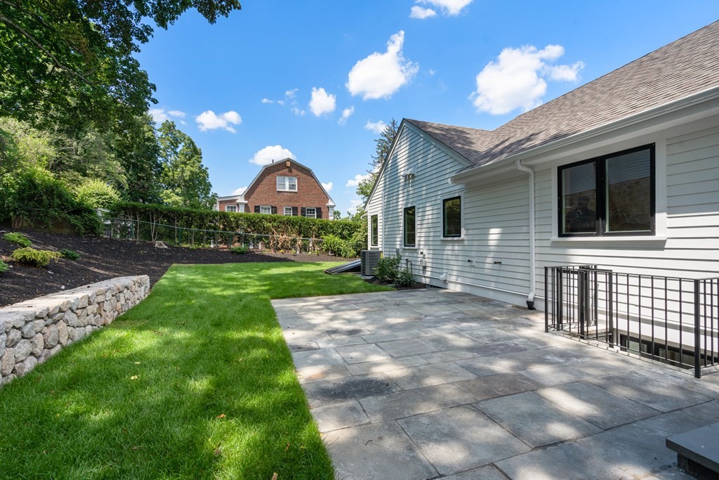 30 Clinton Road Brookline, MA 02445 - Photo 5 of 19 a view of a house with a yard