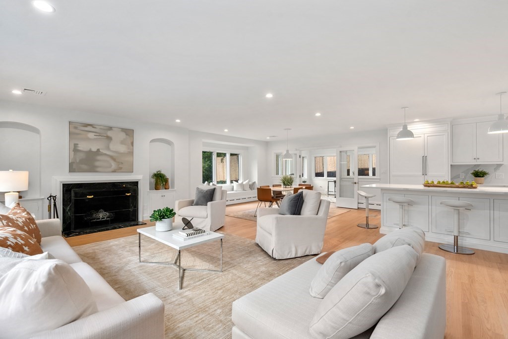 30 Clinton Road Brookline, MA 02445 - Photo 10 of 19 a living room with furniture and a fireplace