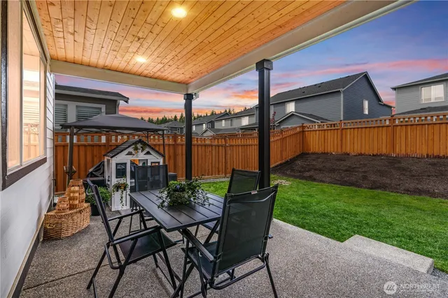 a view of a chair and table in the patio