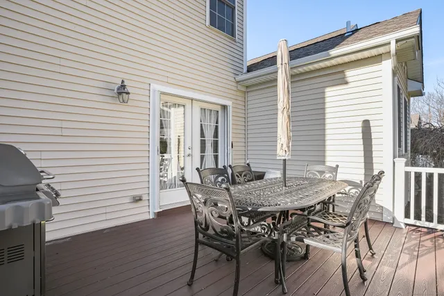 a view of a dinning table and chairs in the balcony