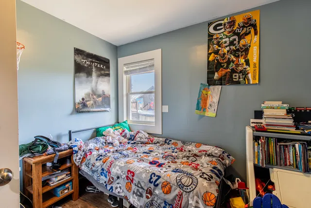 a bedroom with bed and a window