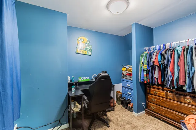 a view of a workspace with furniture