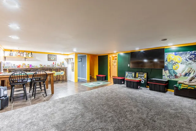 a view of a livingroom with furniture and a flat screen tv