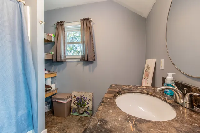 a bathroom with a sink and a mirror
