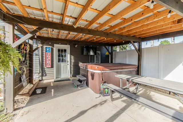 a view of a porch with furniture and a deck