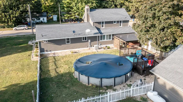 an aerial view of a house with outdoor space