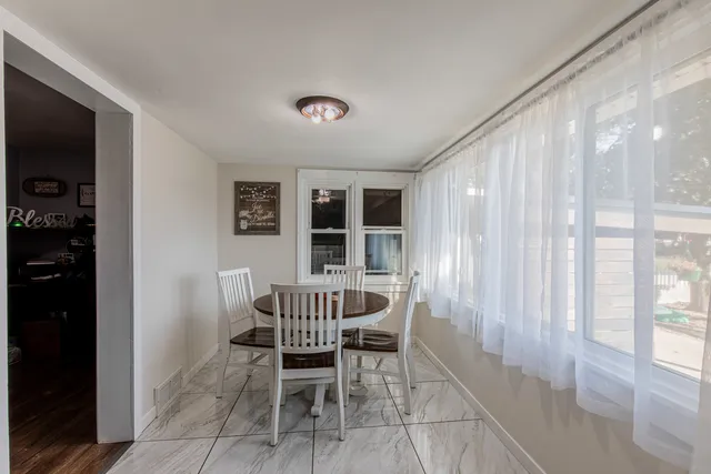 a view of a livingroom with furniture and front door