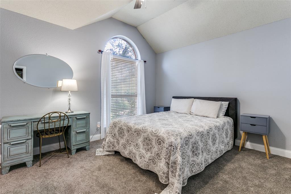 2133 Rim Rock Drive Keller, TX 76248 - Photo 28 of 37 Bedroom featuring lofted ceiling, carpet flooring, and a ceiling fan