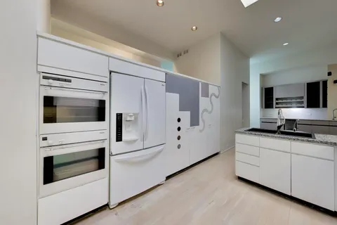 a living room with a couch and a window