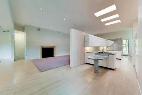 a view of an empty room with a large window