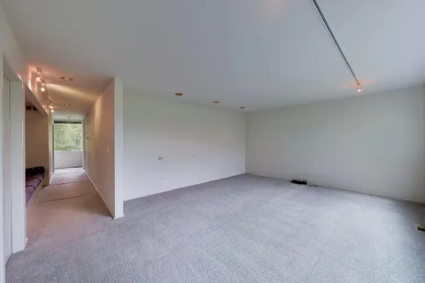 a bathroom with a granite countertop sink a toilet and shower