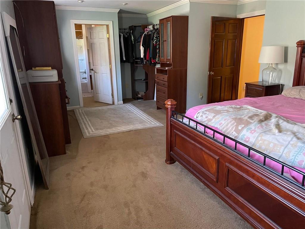 4199 Morgantown Road Smithfield, PA 15478 - Photo 19 of 34 a bed room with a bed and a mirror