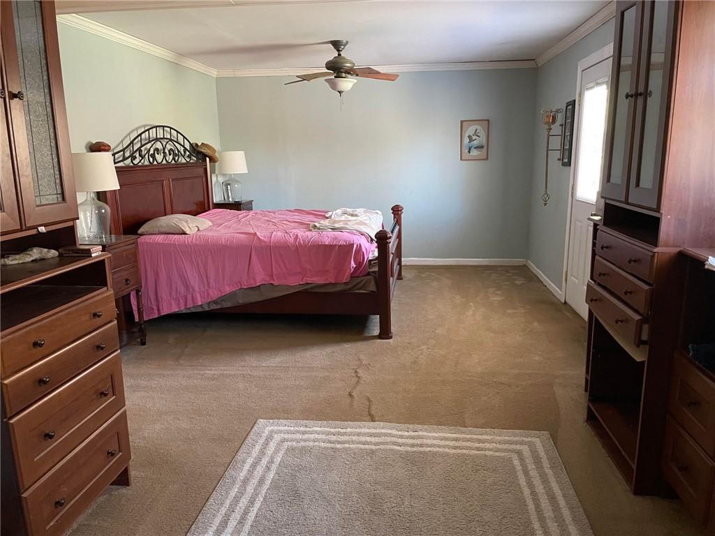 4199 Morgantown Road Smithfield, PA 15478 - Photo 20 of 34 a bedroom with a bed dresser and a window