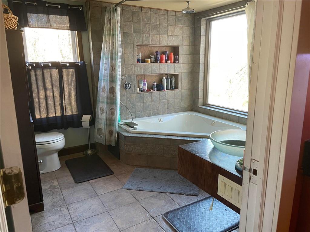 4199 Morgantown Road Smithfield, PA 15478 - Photo 21 of 34 a bathroom with a sink a toilet and a bathtub