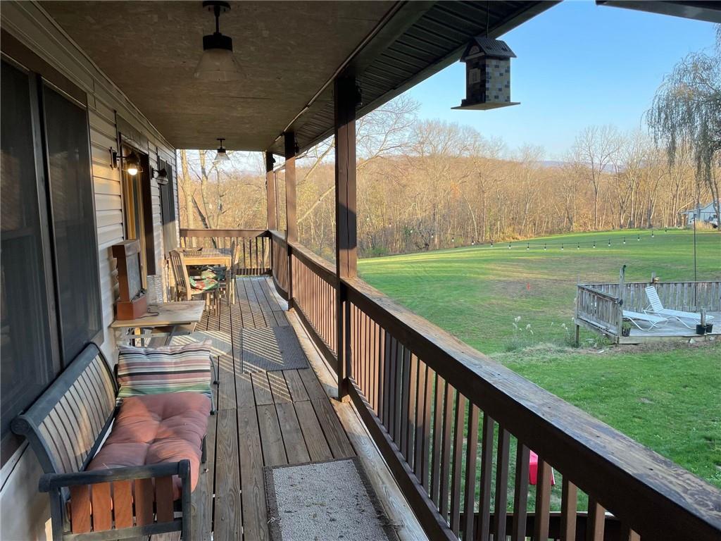 4199 Morgantown Road Smithfield, PA 15478 - Photo 5 of 34 a view of a porch with furniture and garden
