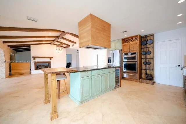 a view of kitchen with furniture and window