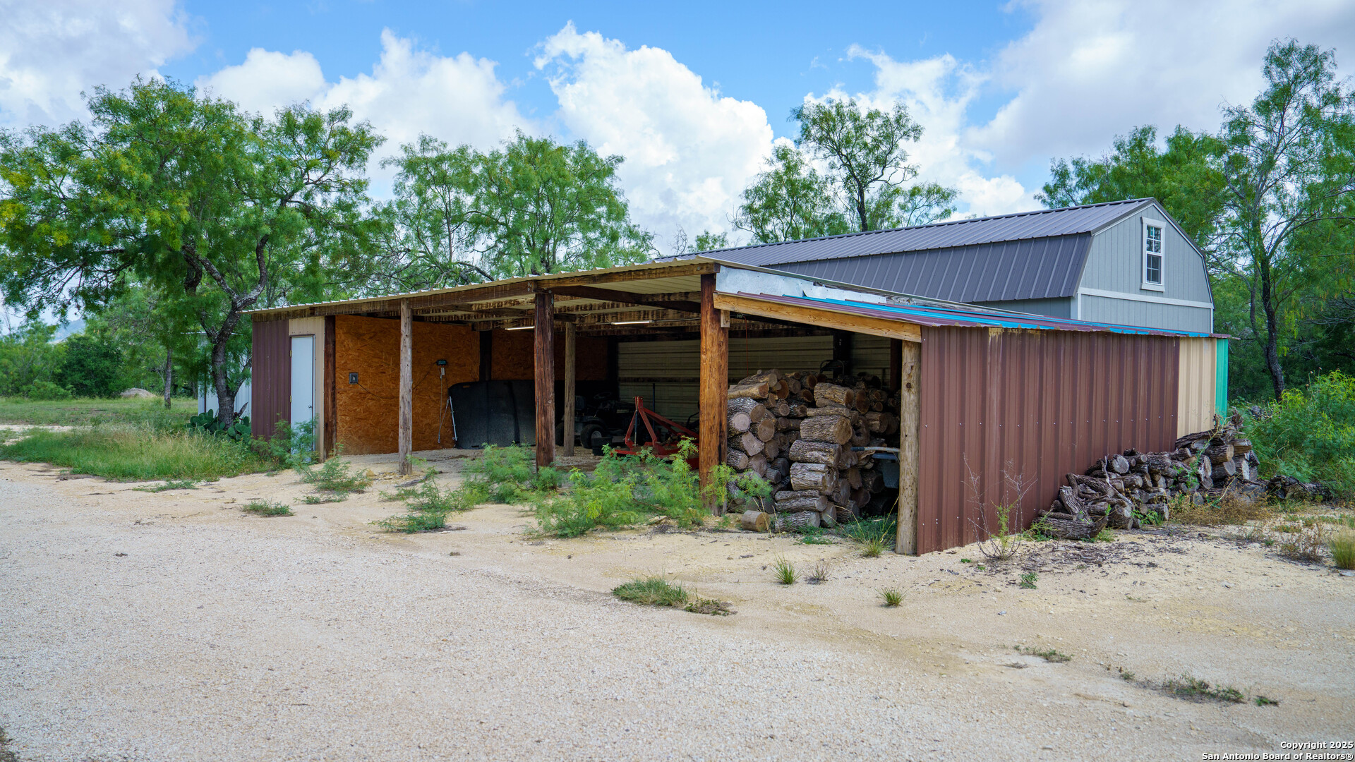 1231 B & R Road Vanderpool, TX 78885 - Photo 6 of 26 a front view of a house with garden