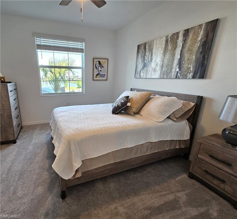 5807 Double Eagle Cir Avenue, Unit 4621 Immokalee, FL 34142 - Photo 16 of 46 Carpeted bedroom with baseboards and a ceiling fan