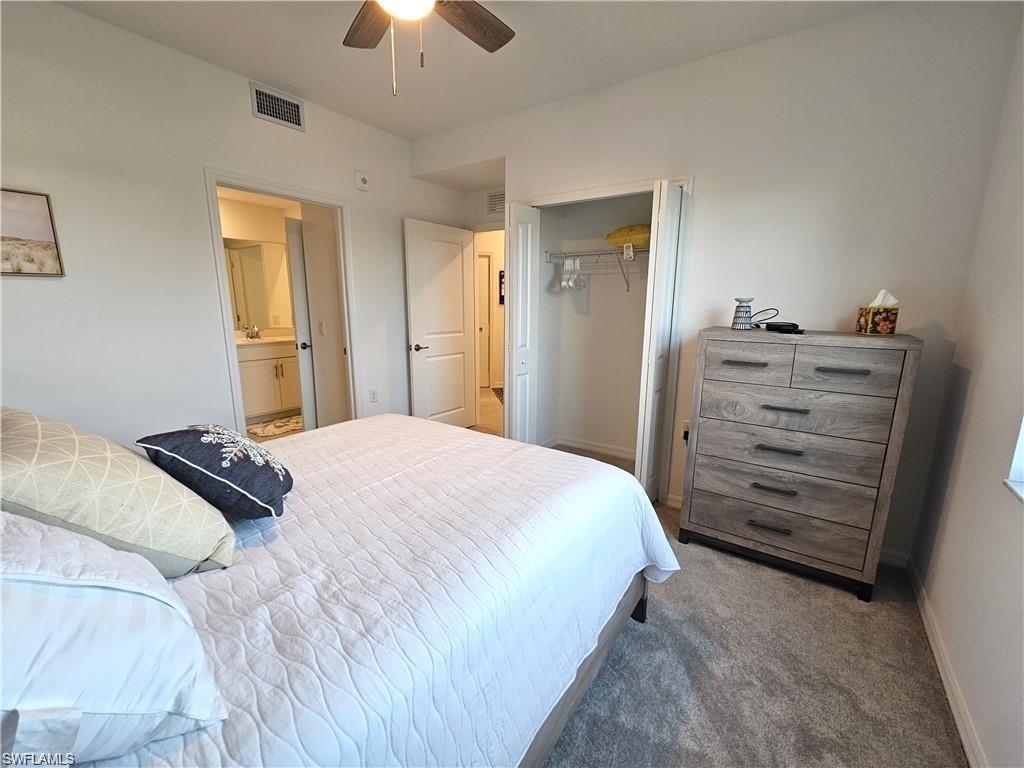 5807 Double Eagle Cir Avenue, Unit 4621 Immokalee, FL 34142 - Photo 17 of 46 Bedroom with baseboards, carpet floors, visible vents, a ceiling fan, and a closet