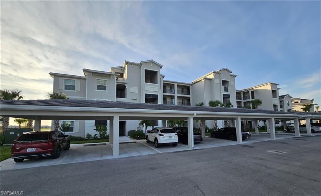 5807 Double Eagle Cir Avenue, Unit 4621 Immokalee, FL 34142 - Photo 2 of 46 View of covered parking lot