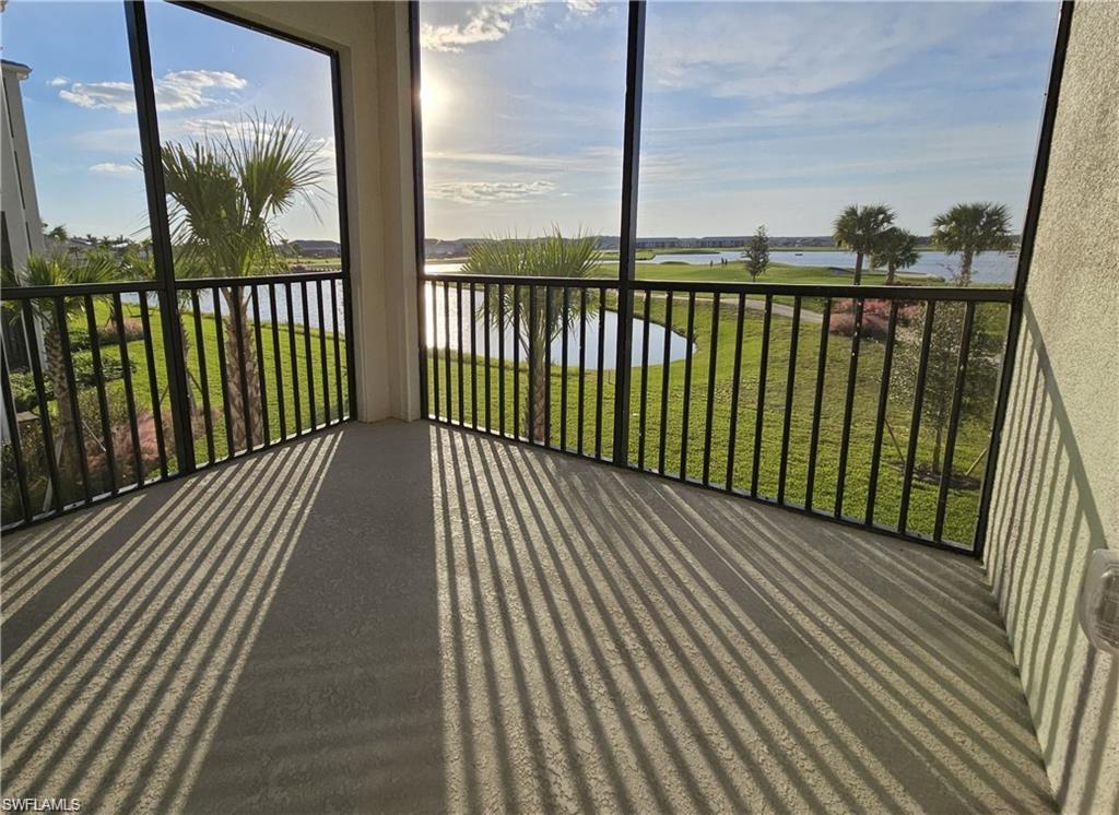 5807 Double Eagle Cir Avenue, Unit 4621 Immokalee, FL 34142 - Photo 24 of 46 Sunroom with a water view and a healthy amount of sunlight