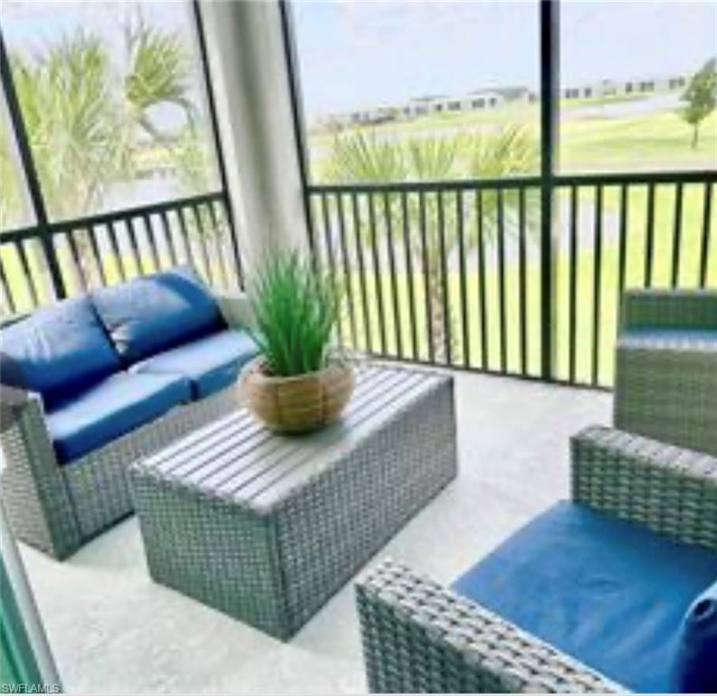 5807 Double Eagle Cir Avenue, Unit 4621 Immokalee, FL 34142 - Photo 25 of 46 Sunroom / solarium with an outdoor living space