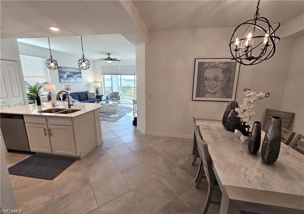 5807 Double Eagle Cir Avenue, Unit 4621 Immokalee, FL 34142 - Photo 46 of 46 Kitchen with dishwasher, open floor plan, a sink, and decorative light fixtures