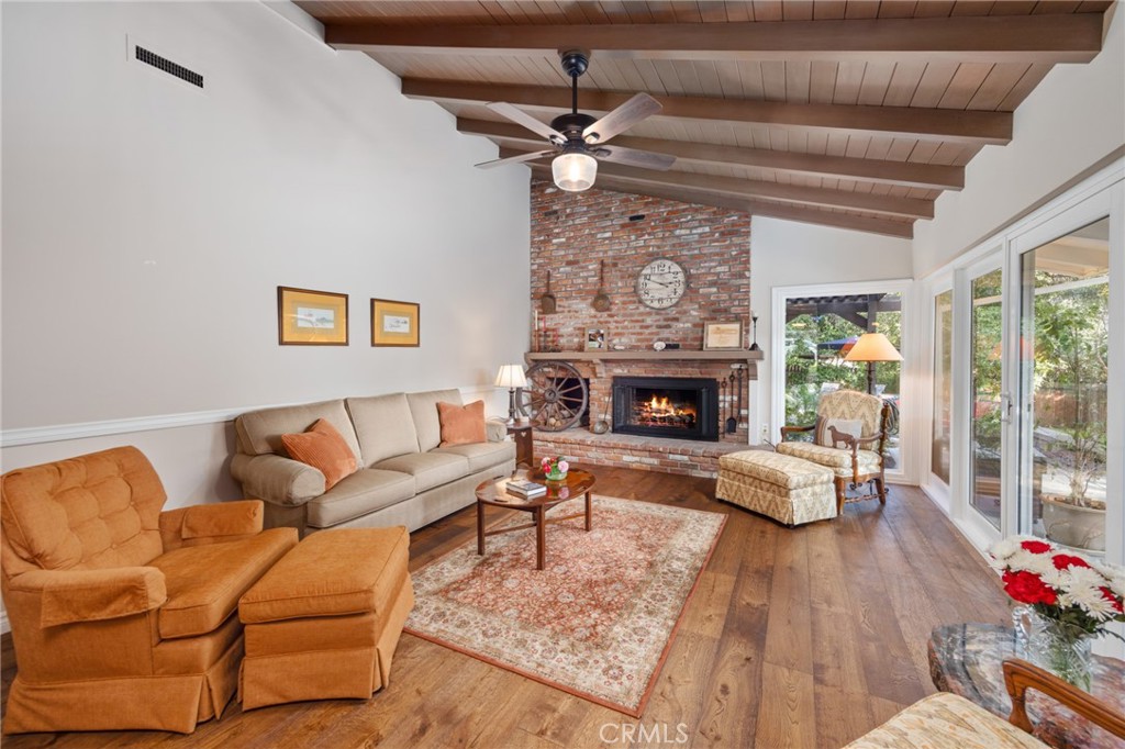 1820 Alta Oaks Drive Arcadia, CA 91006 - Photo 13 of 56 a living room with furniture a fireplace and a large window
