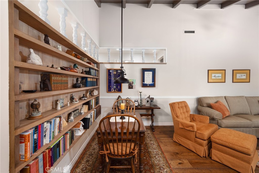 1820 Alta Oaks Drive Arcadia, CA 91006 - Photo 16 of 56 a living room with furniture a flat screen tv and a book shelf
