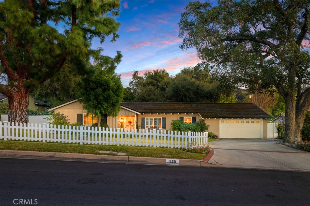 1820 Alta Oaks Drive Arcadia, CA 91006 - Photo 2 of 56 a view of a street with a garden