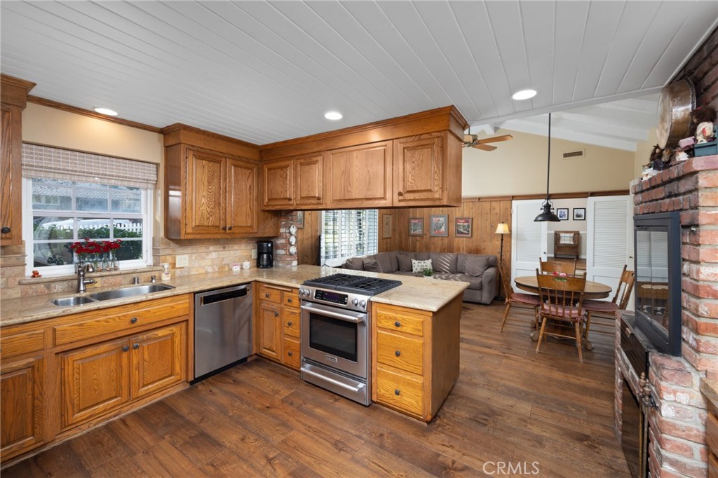 1820 Alta Oaks Drive Arcadia, CA 91006 - Photo 23 of 56 a kitchen with a sink stove and cabinets