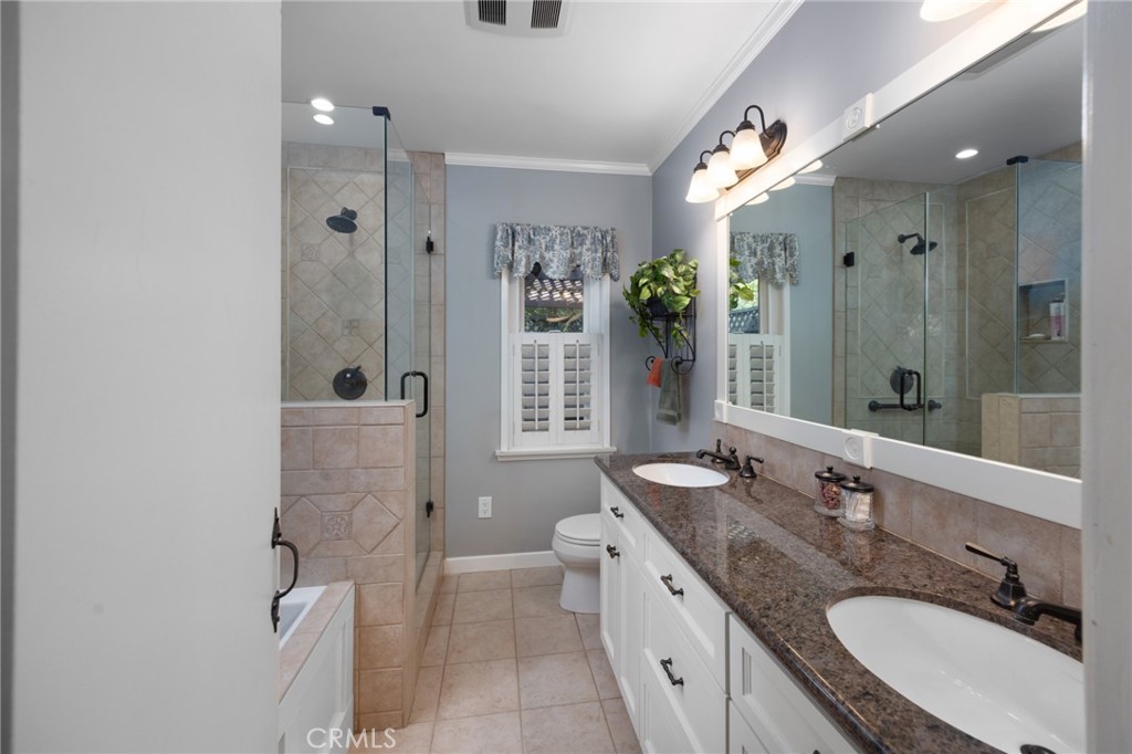 1820 Alta Oaks Drive Arcadia, CA 91006 - Photo 28 of 56 a bathroom with a granite countertop sink mirror and shower