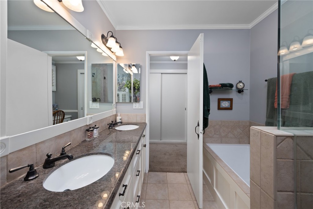 1820 Alta Oaks Drive Arcadia, CA 91006 - Photo 29 of 56 a bathroom with a granite countertop sink and a mirror
