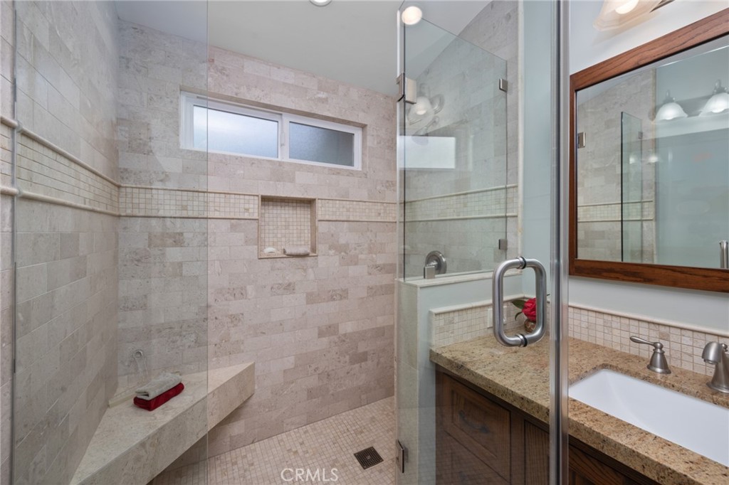 1820 Alta Oaks Drive Arcadia, CA 91006 - Photo 34 of 56 a bathroom with a granite countertop shower a sink and vanity