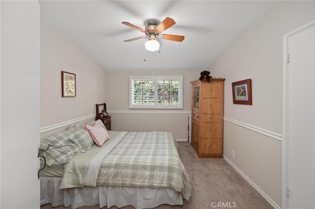 1820 Alta Oaks Drive Arcadia, CA 91006 - Photo 35 of 56 a bedroom with a large bed and a chandelier