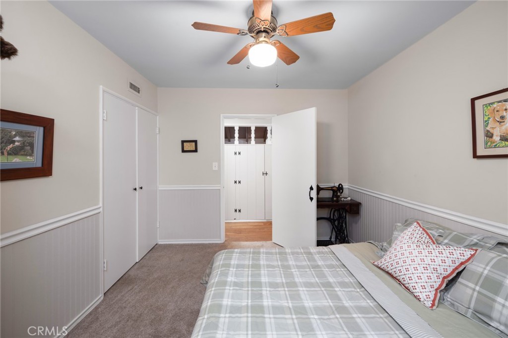 1820 Alta Oaks Drive Arcadia, CA 91006 - Photo 36 of 56 a bedroom with a bed and a chandelier