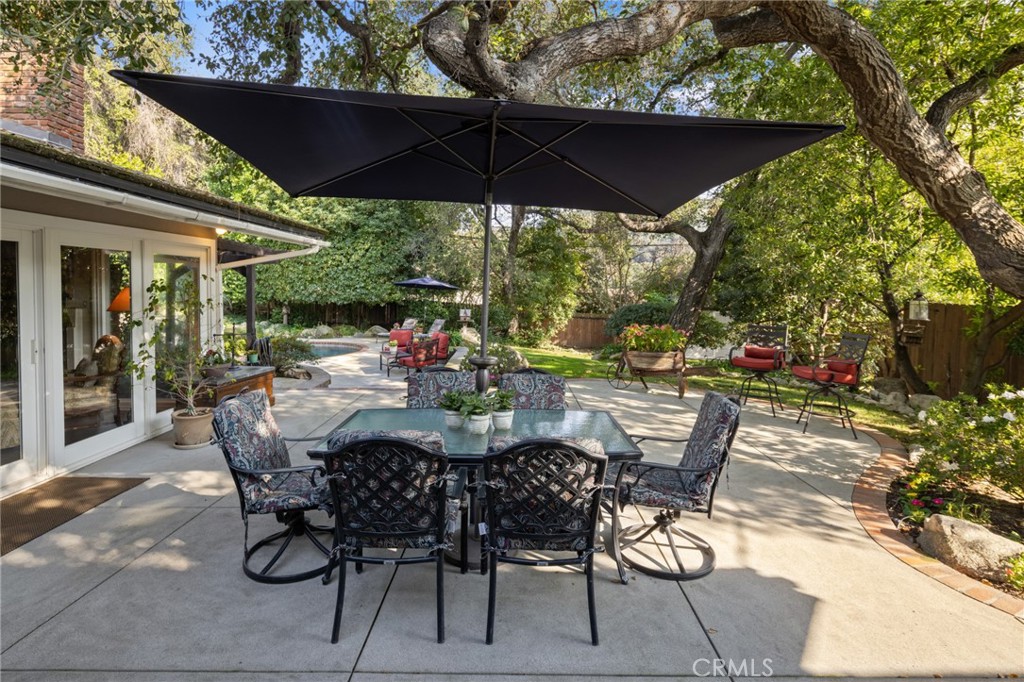 1820 Alta Oaks Drive Arcadia, CA 91006 - Photo 41 of 56 a view of a patio with table and chairs under an umbrella