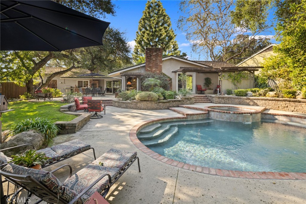 1820 Alta Oaks Drive Arcadia, CA 91006 - Photo 43 of 56 front view of a house with a yard table and chairs