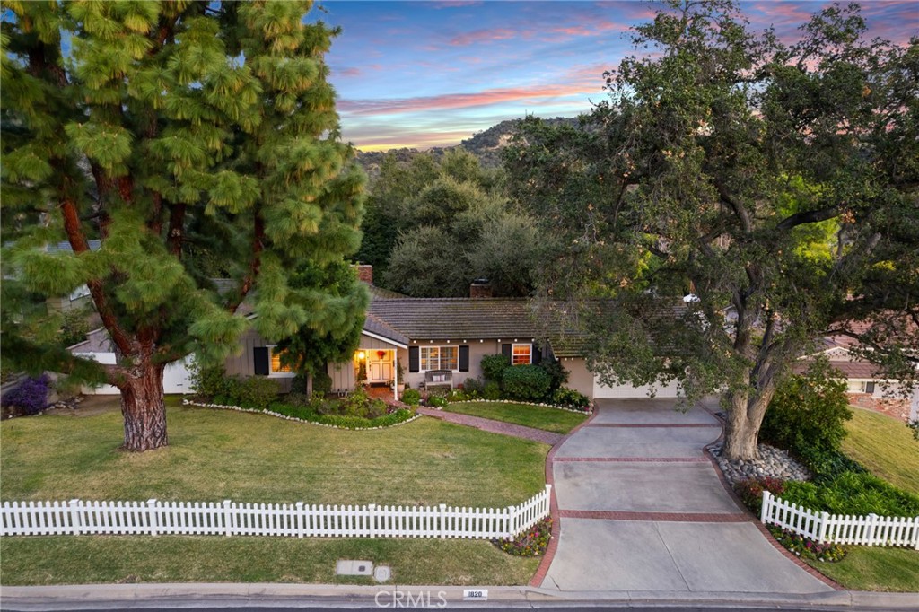 1820 Alta Oaks Drive Arcadia, CA 91006 - Photo 50 of 56 a front view of a house with a yard