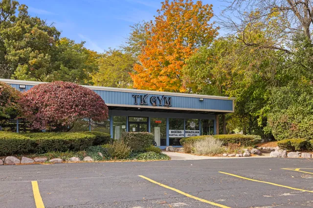 a view of a car park in front of a house