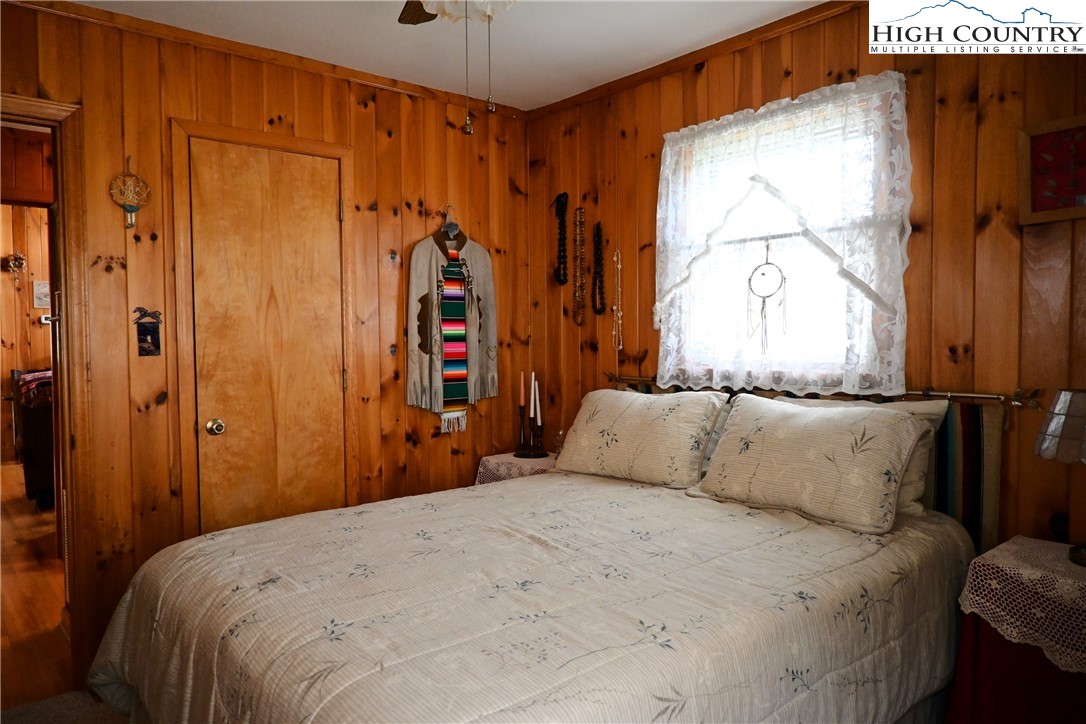 280 Smoky Hollow Road Laurel Springs, NC 28644 - Photo 19 of 42 a bedroom with a bed and a window
