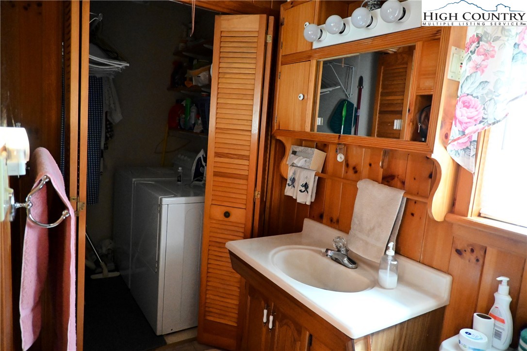 280 Smoky Hollow Road Laurel Springs, NC 28644 - Photo 22 of 42 a bathroom with a sink and a mirror