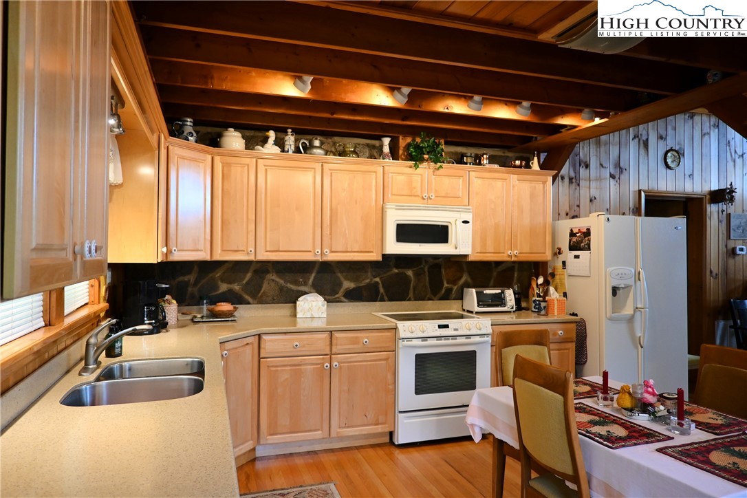 280 Smoky Hollow Road Laurel Springs, NC 28644 - Photo 6 of 42 a kitchen with appliances cabinets and a sink