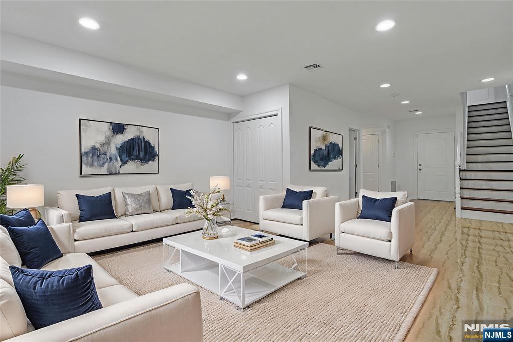 52 Myrtle Avenue, Unit B Edgewater, NJ 07020 - Photo 15 of 20 a living room with furniture and a couch