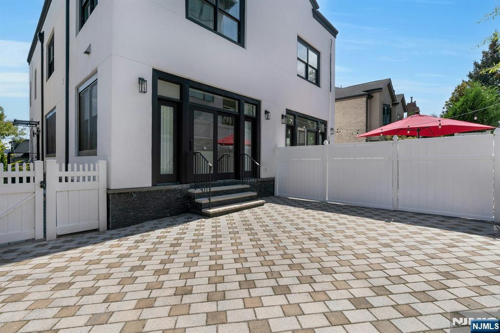 52 Myrtle Avenue, Unit B Edgewater, NJ 07020 - Photo 17 of 20 a front view of a house with a yard