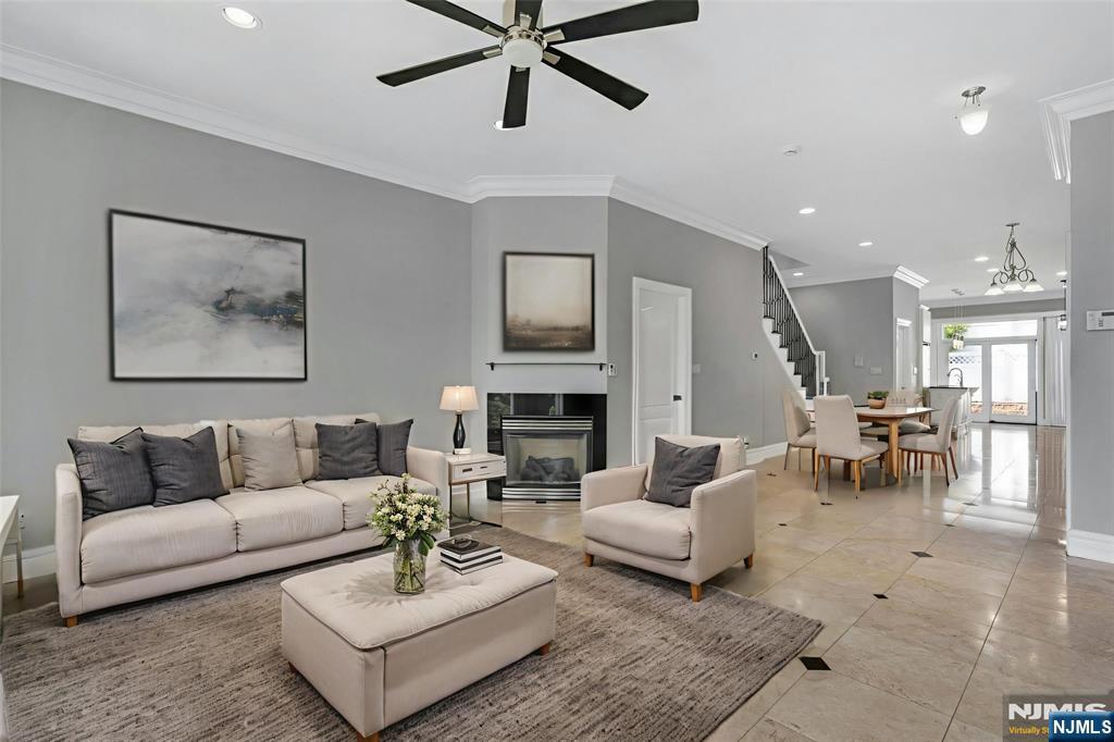 52 Myrtle Avenue, Unit B Edgewater, NJ 07020 - Photo 2 of 20 a living room with furniture and a fireplace