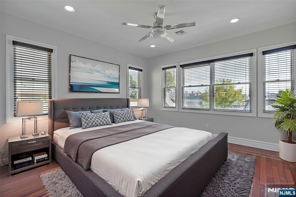 52 Myrtle Avenue, Unit B Edgewater, NJ 07020 - Photo 7 of 20 a bedroom with a large bed and a window