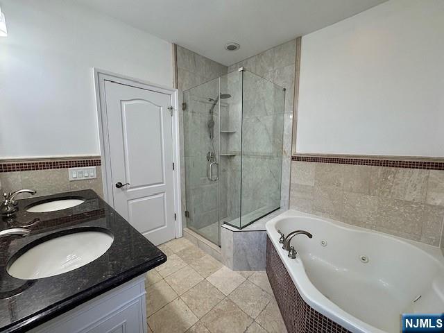 52 Myrtle Avenue, Unit B Edgewater, NJ 07020 - Photo 9 of 20 a bathroom with a sink a toilet and shower